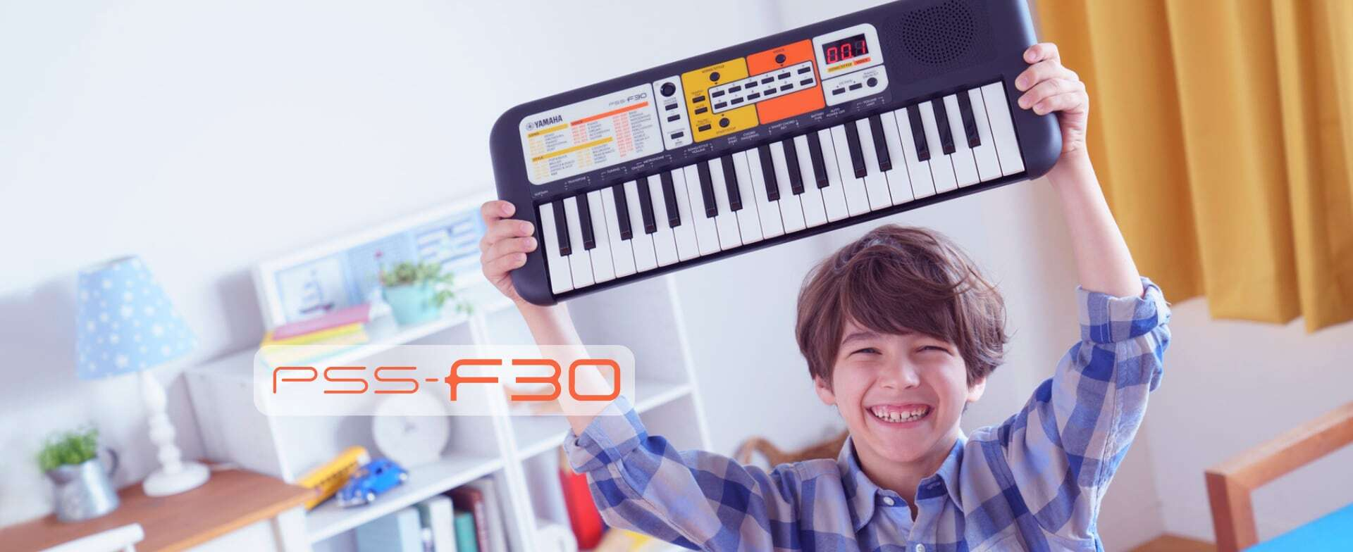 Синтезатор Yamaha PSS-F30 з яскравою жовто-помаранчевою панеллю